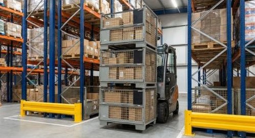 Steel mesh stillages loaded on forklift